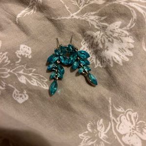 Blue dangling rhinestone earrings.
